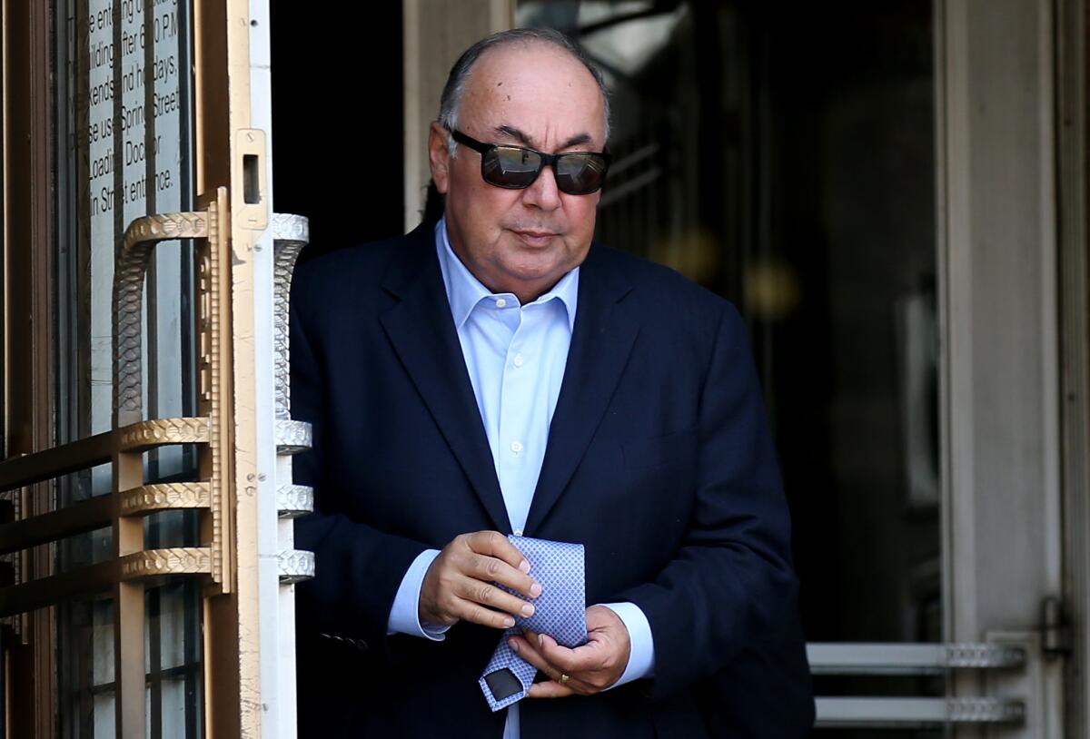 Former California Assemblyman Tom Calderon leaves federal court in Los Angeles after a sentencing hearing Monday.