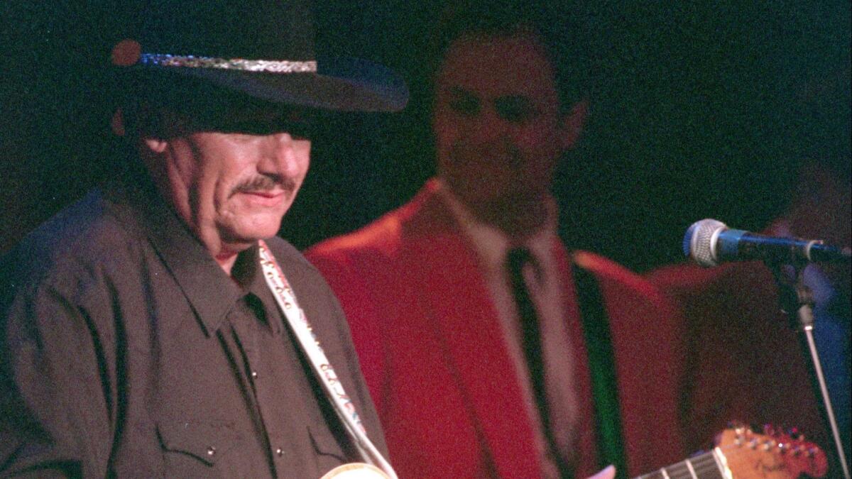 Guitarist Nokie Edwards, shown during a 1996 performance in Orange County, died March 12 at age 82.