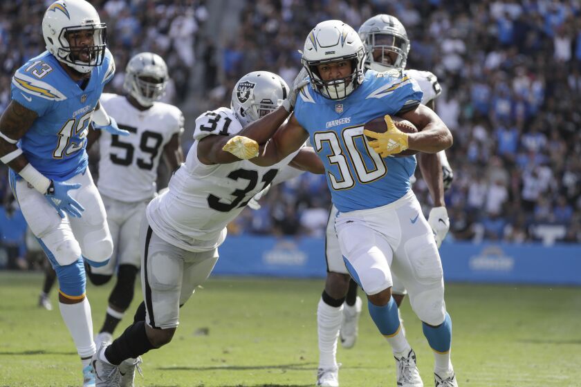 CARSON, CA, SIUNDAY, OCTOBER 7, 2018 - Chargers running back Austin Ekeler outruns the Raiders defense for a 44-yard touchdown on a screen pass from Philip Rivers at StubHub Center. (Robert Gauthier/Los Angeles Times)