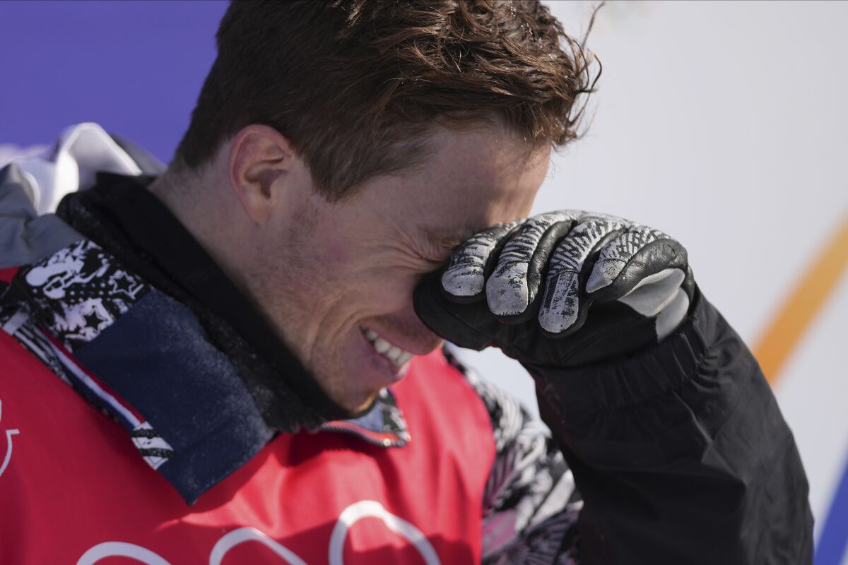 Shaun White reacts after competing in the men's snowboard halfpipe final Friday.