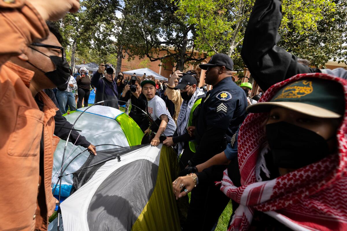  Campus safety officers try to confiscate tents