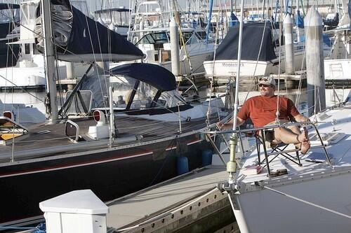 Mark Nicholas sits on his boat in San Pedro. With housing prices high, living on a boat is gaining popularity among ocean lovers.