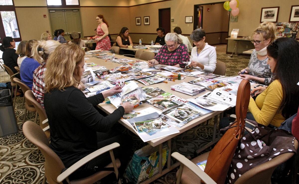 About two dozen people showed up to create vision boards from magazine cuttings at a do-it-yourself vision board party at the Buena Vista Branch of the Burbank Library on Saturday, Jan. 16, 2016.
