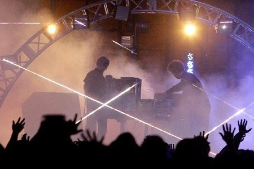 Jas Shaw, left, and James Ford of the electronic music duo Simian Mobile Disco perform on the first day of FYF Fest.