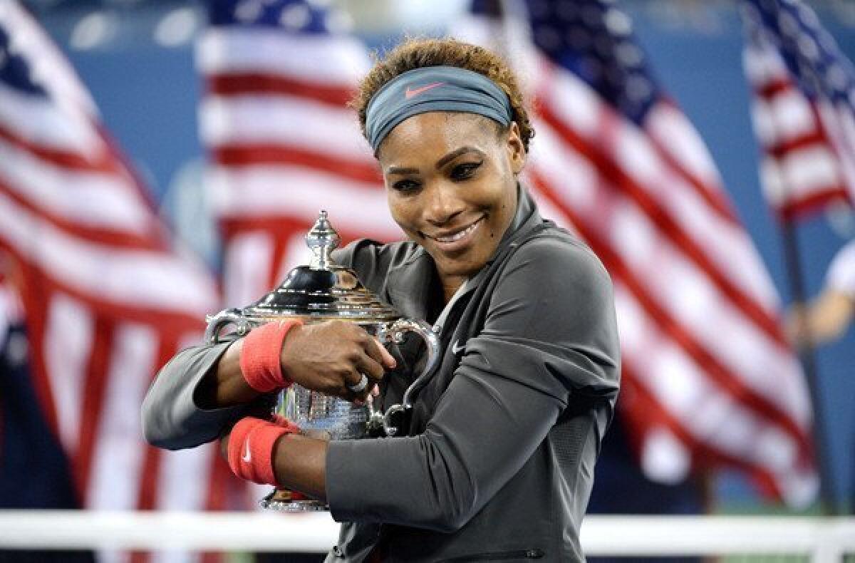 Serena Williams holds the winner's trophy after defeating Victoria Azarenka in the U.S. Open women's championship match on Sunday in New York.