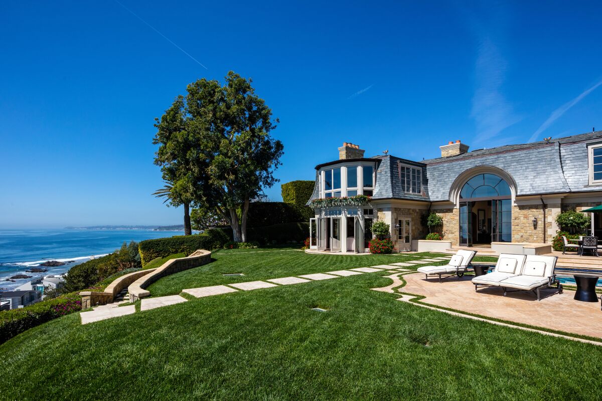 Philanthropists James and Eleanor Randall have sold Malibu estate, which sits on a 1.7-acre bluff with panoramic ocean views, for $23.425 million.