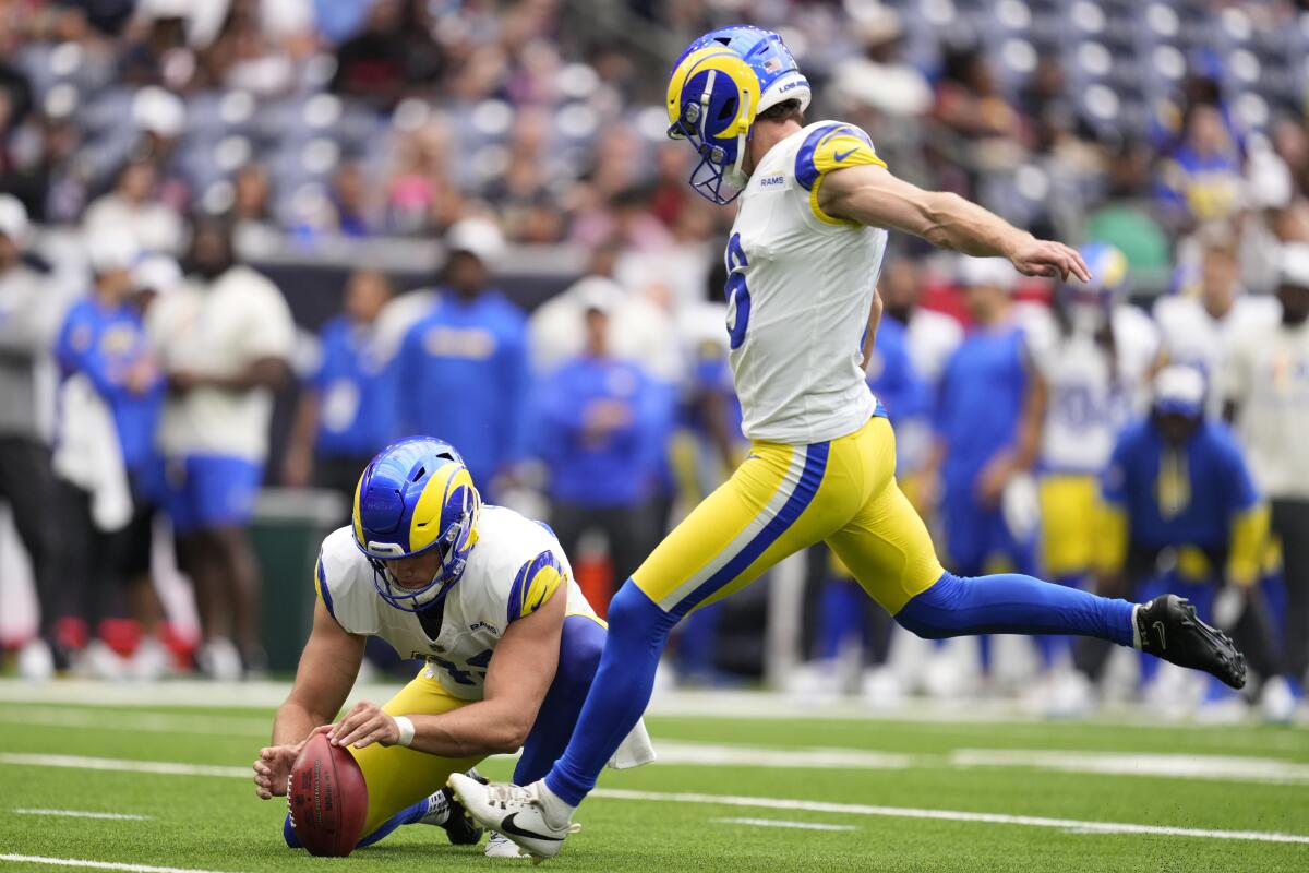 Joshua Karty kicks a 21-yard field goal for the Rams in the first half against the Texans on Saturday.