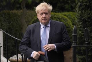 FILE - Boris Johnson leaves his house in London, on March 22, 2023. Former Prime Minister Boris Johnson deliberately misled Parliament about the lockdown-flouting parties that undermined his credibility and contributed to his downfall, a committee of lawmakers said Thursday, June 15, 2023 after a year-long investigation. (AP Photo/Alberto Pezzali, File)