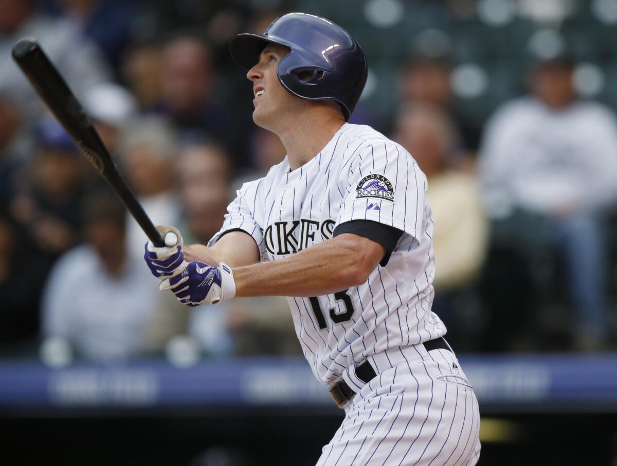 Colorado Rockies pinch-hitter Drew Stubbs watches the flight of a two-run home run during a game against the Arizona Diamondbacks on May 6.