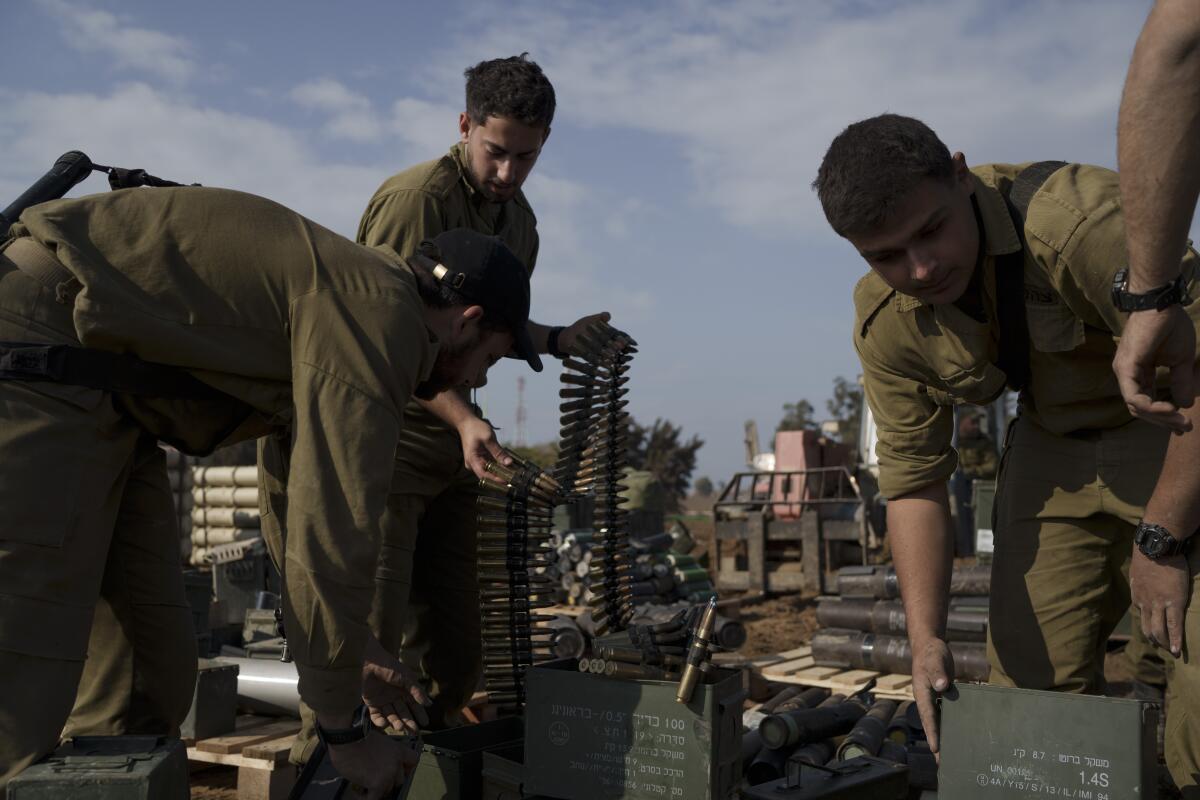Israeli soldiers store ammunition in a staging area at the Israel-Gaza border on Jan. 2.
