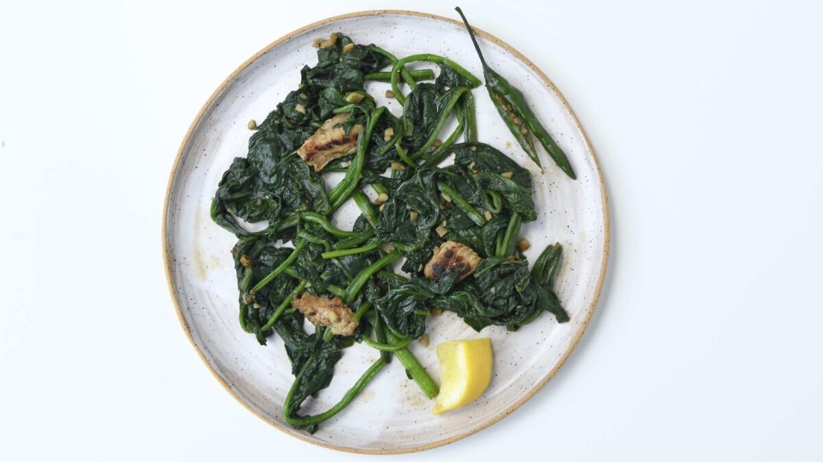 Mam tom, the Vietnamese shrimp paste, makes a umami-rich sauce for this stir-fry of water spinach and pork. Prop styling by Nidia Cueva.