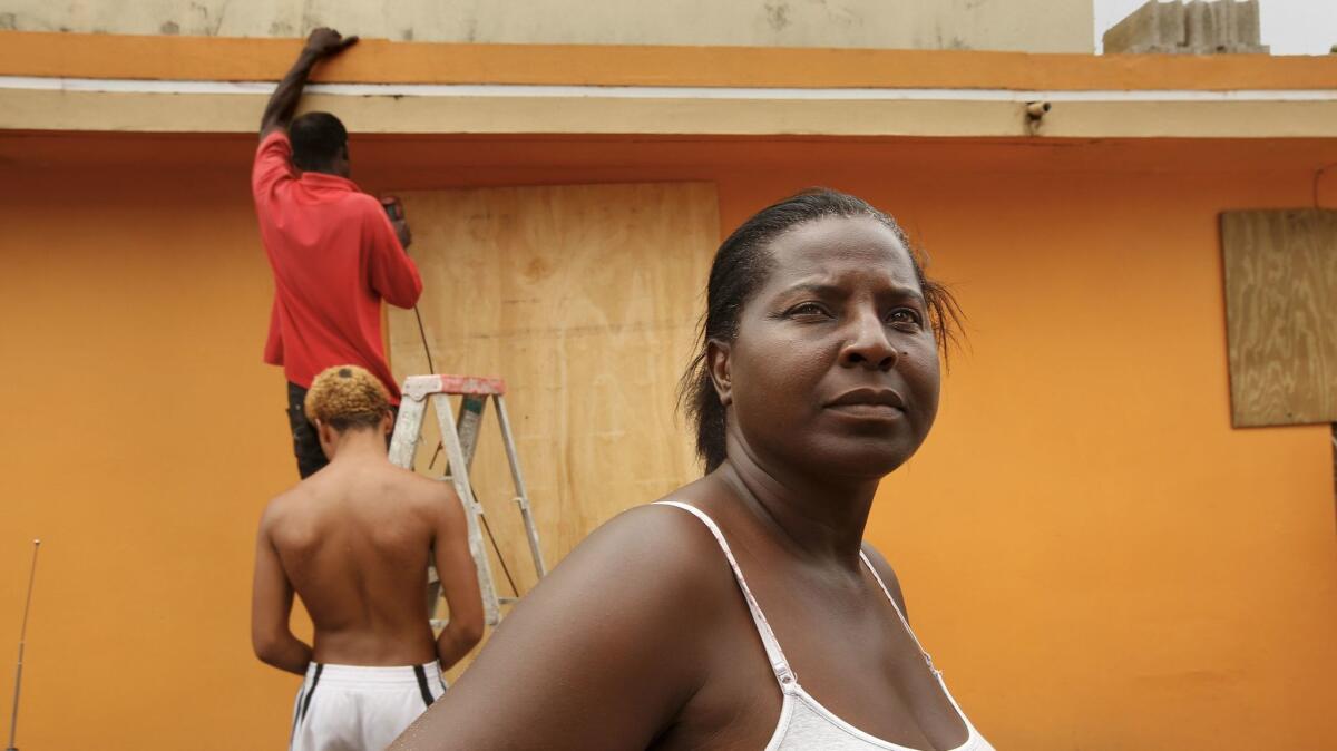Monica Pisarro, age 49, outside her home in Loiza.