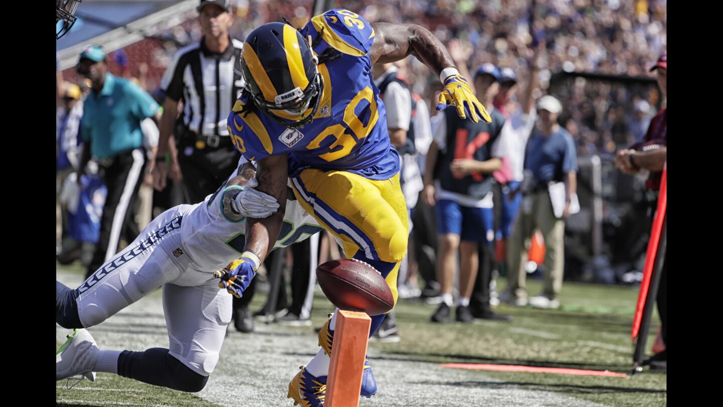 Rams running back Todd Gurley fumbles the ball at the goal line after behing hit by Seahawks safety Earl Thomas during the first quarter. Since the ball hit the pylon, the play was ruled a touchback and possession was awarded to the Seahawks.