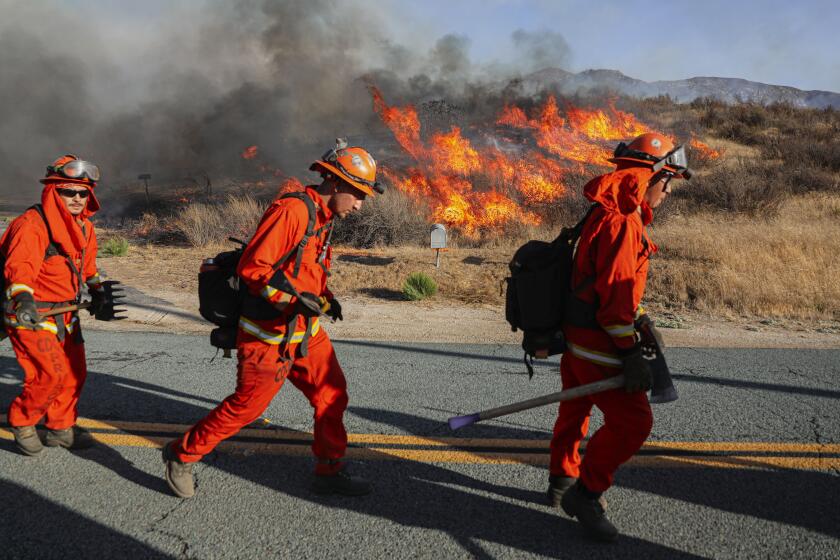 Jamul CA-AUG 31: CalFire HandCrews prepare to b attle a wildfire along Barrett Junction Rd on San Diego on Wednesday, August 31, 2022(Photo by Sandy Huffaker for The SD Union-Tribune)