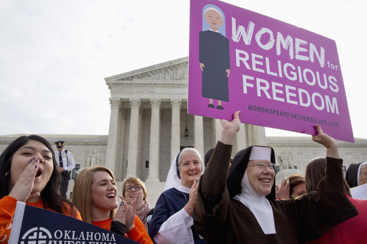 Nuns and their supporters rally outside the Supreme Court.
