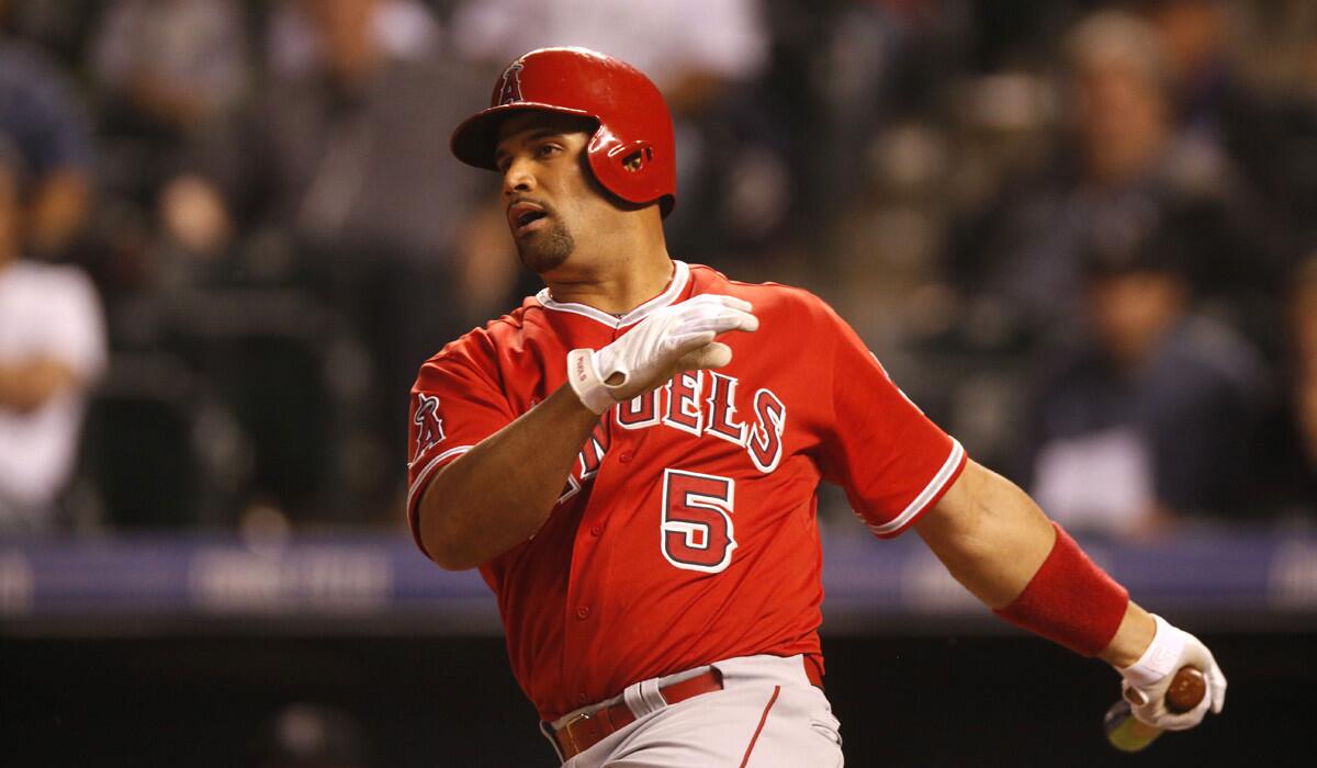 Los Angeles Angels first baseman Albert Pujols bats against the Colorado Rockies during the game on Tuesday. The Angels won 10-2.