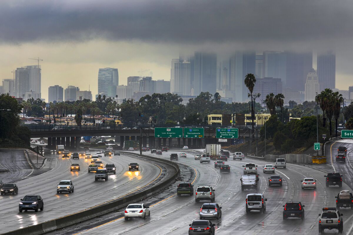 Thick clouds cover the downtown Los Angeles skyline Dec. 4 amid steady rain. 