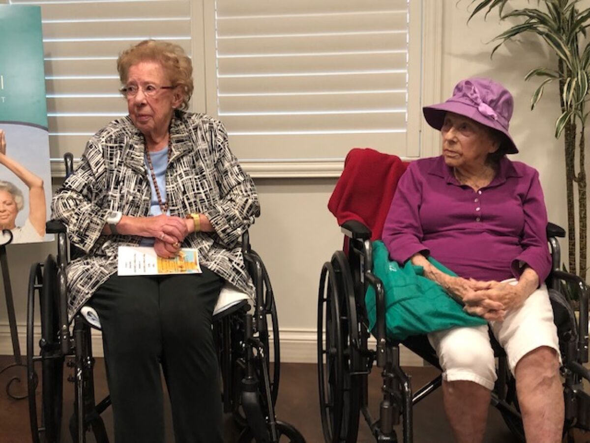 Captain Georgia McKearly and Evelyn Murray share stories Sept. 22, 2019 for a National Centenarian Day event held at the senior living community, Vi at La Jolla Village.