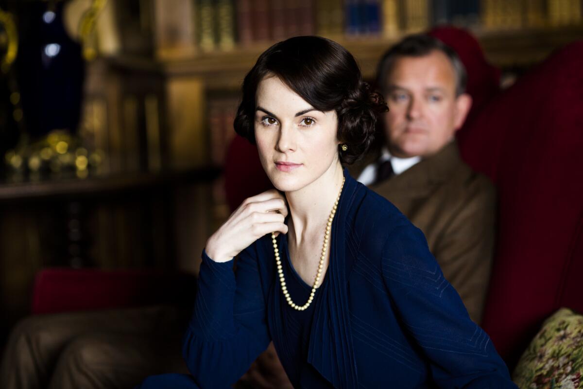 Michelle Dockery and Hugh Bonneville in "Downton Abbey"