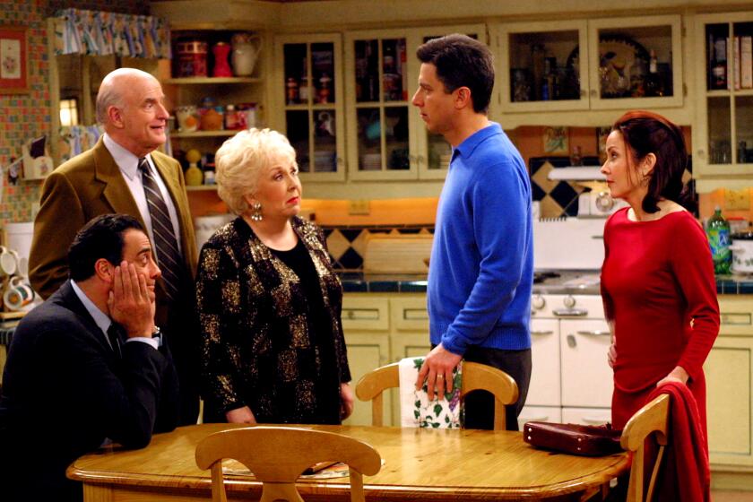 EVERYBODY LOVES RAYMOND - CBS SERIES -"The Skit" -- Ray and Debra (Ray Romano and Patricia Heaton) apologize to Frank and Marie (Peter Boyle and Doris Roberts) when they realize they may have hurt their feelings by imitating them in front of their friends, on EVERYBODY LOVES RAYMOND, scheduled to air on the CBS Television Network. pictured from left to right: Brad Garrett (seated), Peter Boyle, Doris Roberts, Ray Romano, Patricia Heaton copyright: Photo: Robert Voets/CBS ©2002 CBS Worldwide Inc. All Rights Reserved