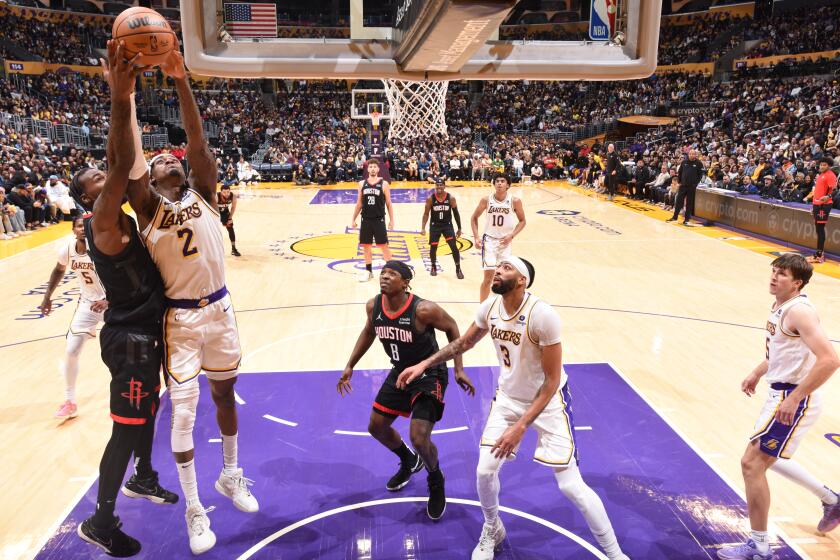 LOS ANGELES, CA - DECEMBER 2: Jarred Vanderbilt #2 of the Los Angeles Lakers grabs the rebound during the game on December 2, 2023 at Crypto.Com Arena in Los Angeles, California. NOTE TO USER: User expressly acknowledges and agrees that, by downloading and/or using this Photograph, user is consenting to the terms and conditions of the Getty Images License Agreement. Mandatory Copyright Notice: Copyright 2023 NBAE (Photo by Adam Pantozzi/NBAE via Getty Images)