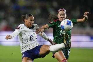 United States forward Lynn Williams, left, and Mexico defender Greta Espinoza, right, vie for the ball.