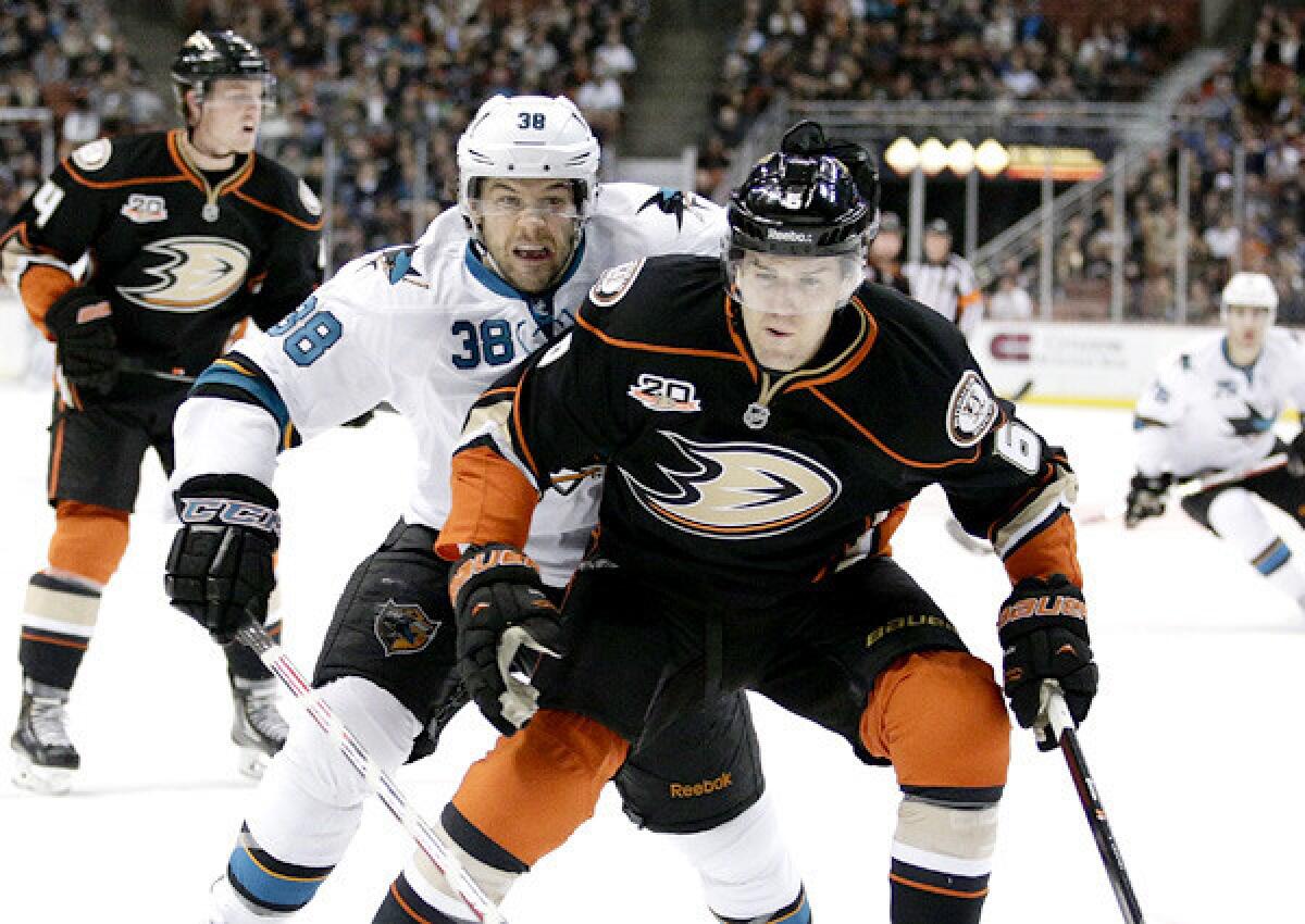 Ducks defenseman Luca Sbisa beats Sharks winger Bracken Kearns to the puck in the corner during a game earlier this season in Anaheim.