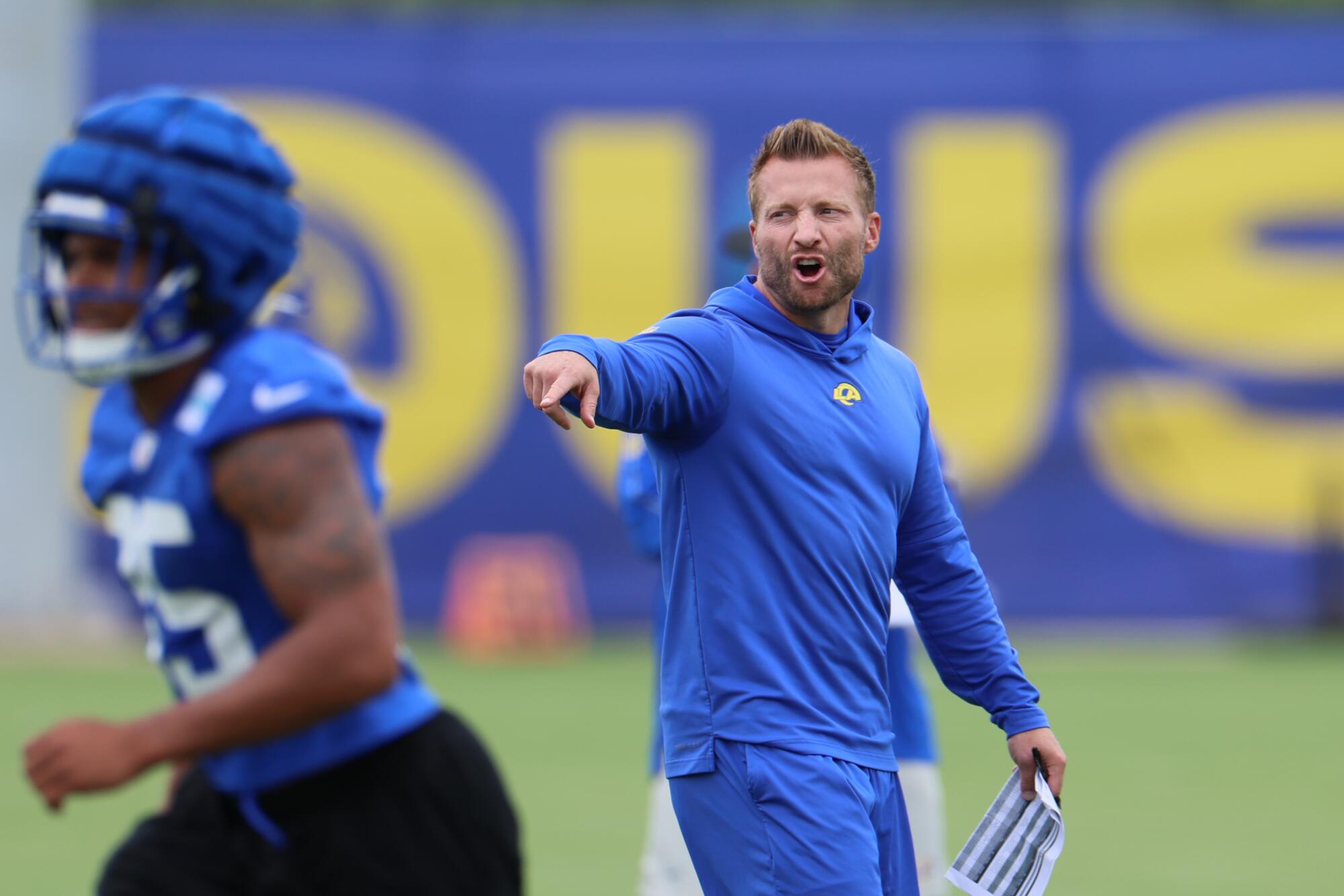 Rams coach Sean McVay directs players during workouts in May.