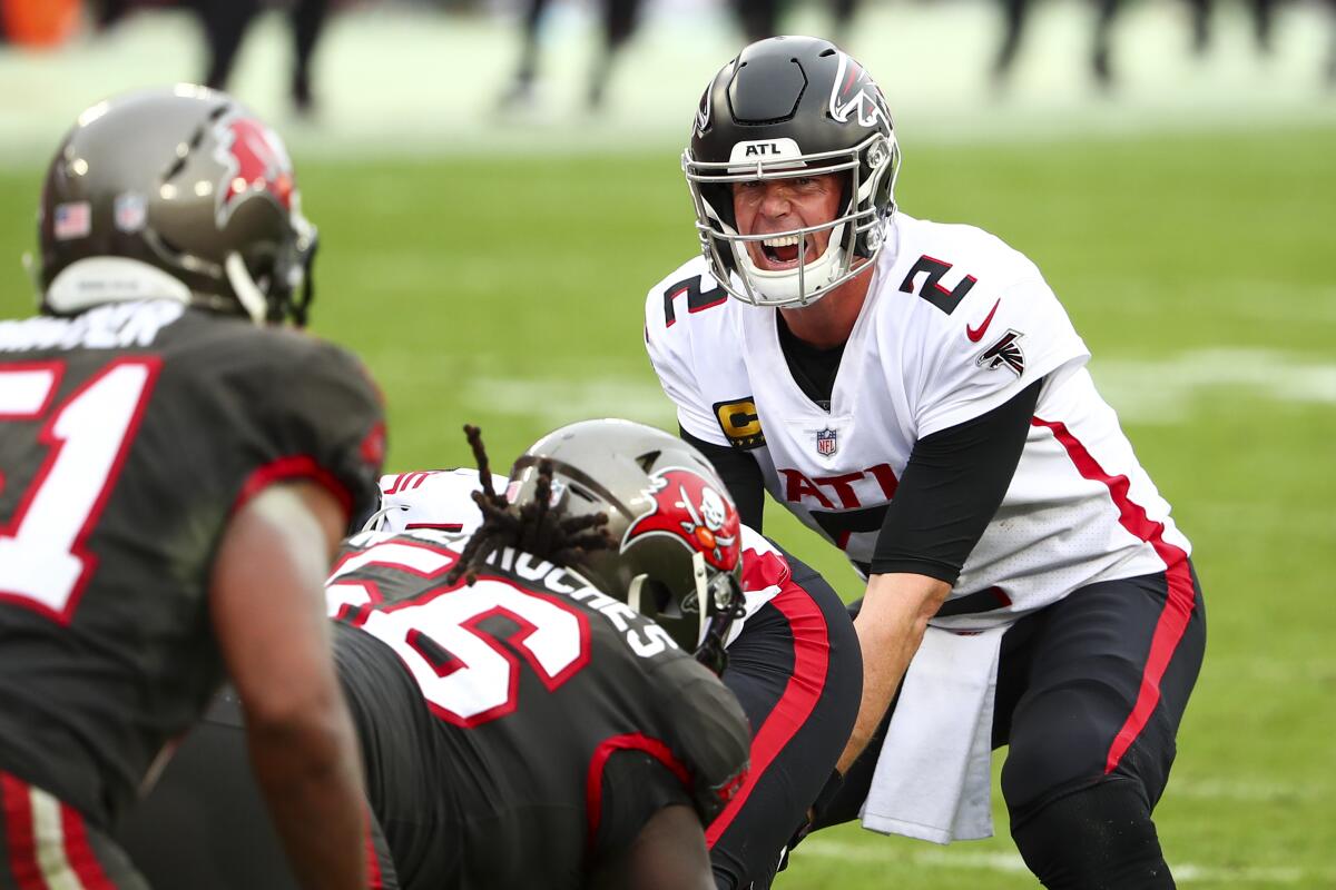 Atlanta Falcons quarterback Matt Ryan lines up behind his offensive line during a game against the Tampa Bay Buccaneers.