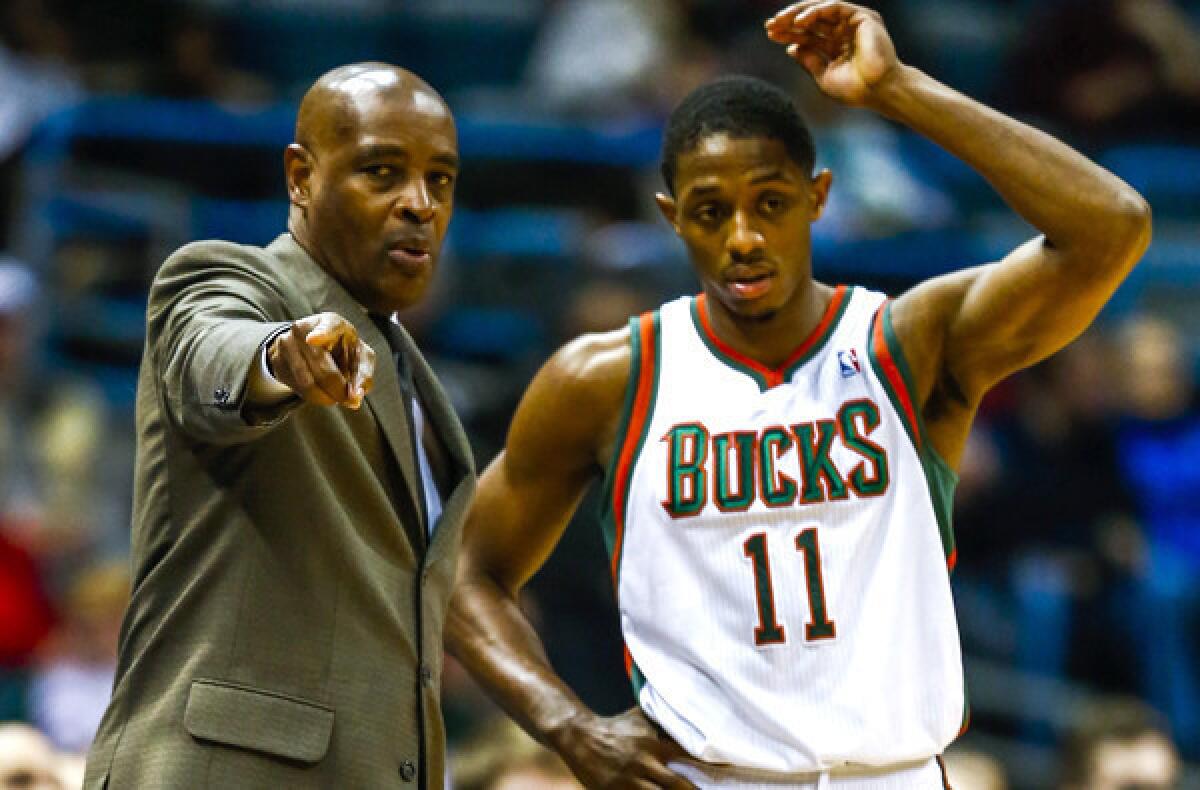 Bucks Coach Larry Drew talks to point guard Brandon Knight during a break in a game against the Wizards earlier this month.