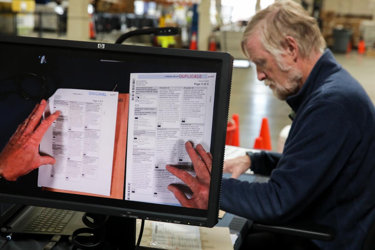 A man works on ballots