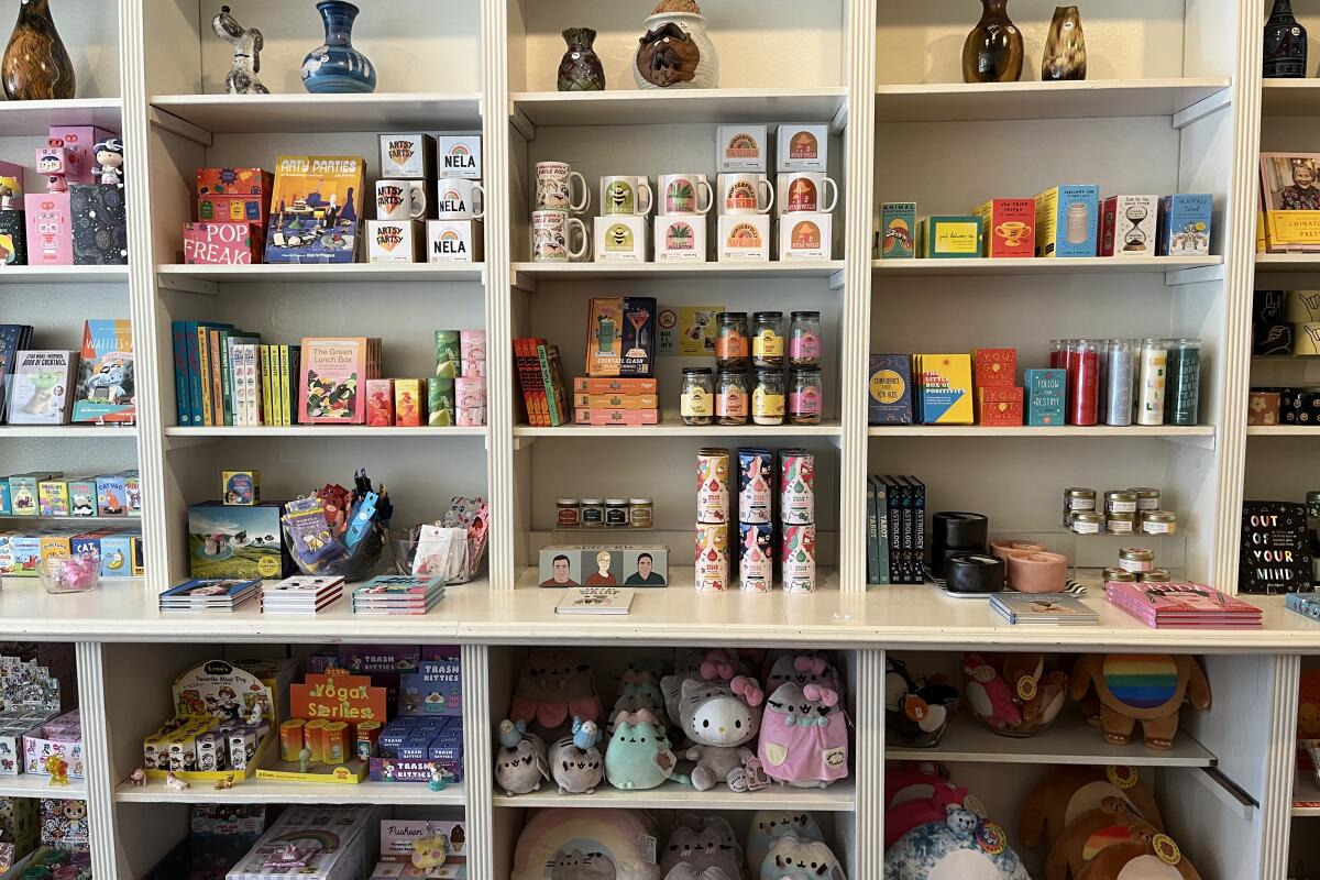 Shelves with toys, mugs and stuffed animals