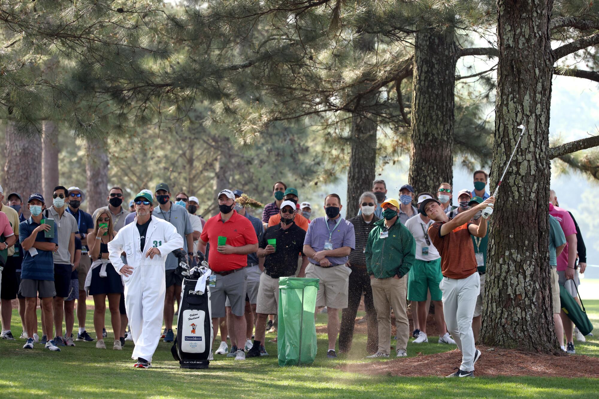 Viktor Hovland of Norway hits an iron shot on the first hole