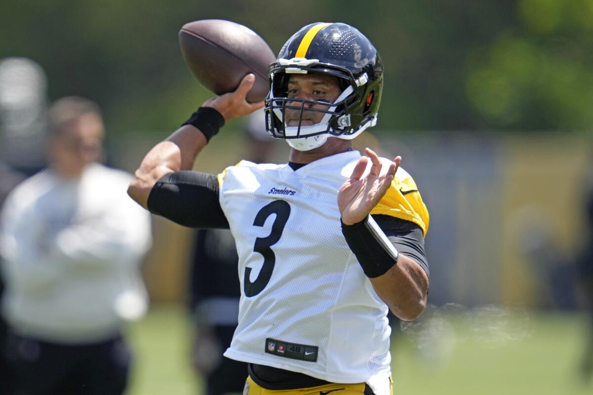 Pittsburgh Steelers quarterback Russell Wilson throws a pass during the team's NFL mini-camp football practice in Pittsburgh.