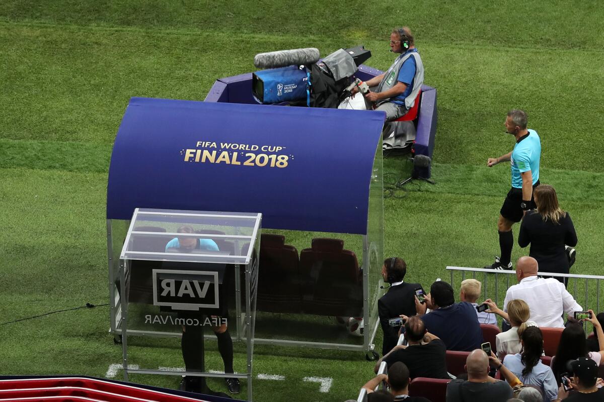 Referee Nestor Pinata reviews VAR footage before awarding France a penalty during the 2018 FIFA World Cup Final between France and Croatia at Luzhniki Stadium on July 15, 2018 in Moscow, Russia.