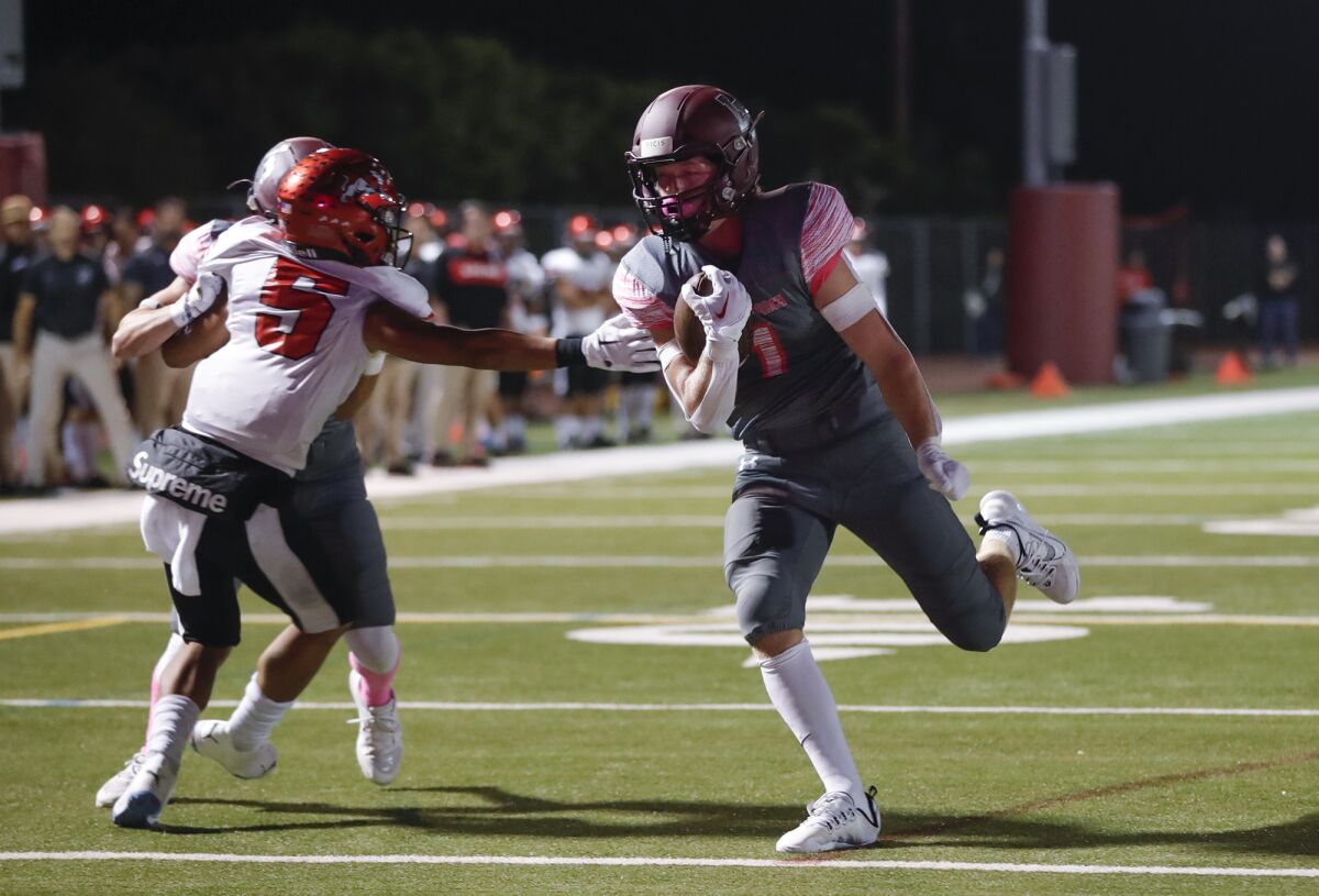 Laguna Beach running back Nick Rogers (1) steps into the end zone for a touchdown during a Pac 4 League football game.
