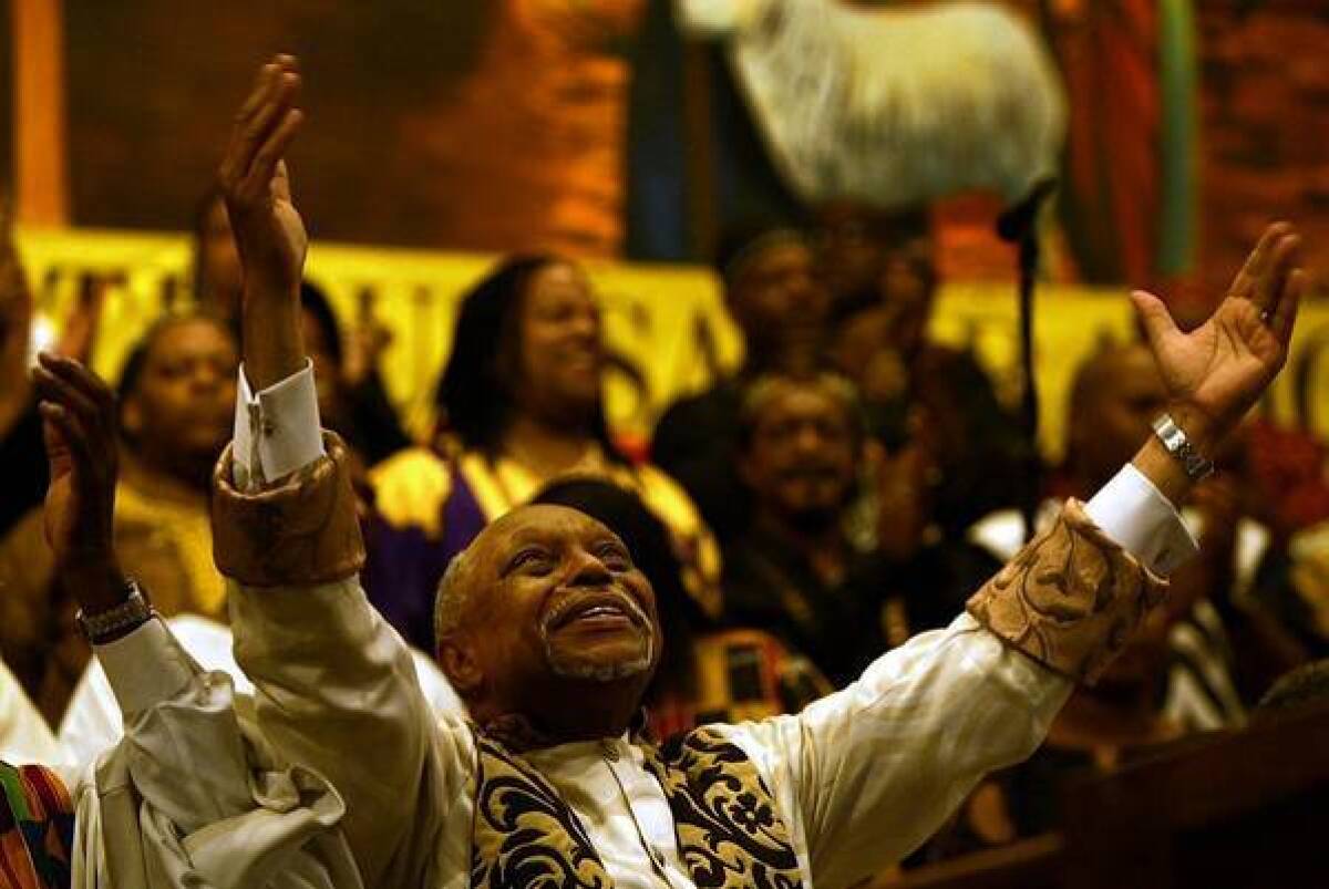 The Rev. Cecil L. "Chip" Murray presides over his last service at First AME church in 2004. Today, Murray's a rare guest at the church he built from 250 members to a congregation of 16,000.
