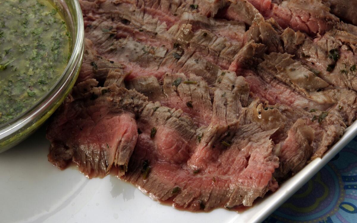 Grilled flank steaks with chimichurri sauce
