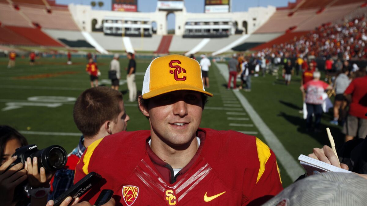 USC quarterback Cody Kessler speaks to reporters after the team's spring game at the Coliseum in April. With the school no longer under NCAA-imposed sanctions, will Kessler help the Trojans return to the top of the Pac-12?