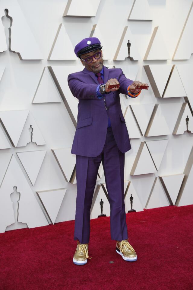 MISS: Spike Lee gets points for paying tribute to Prince with a purple suit and a long necklace featuring the late artist's ubiquitous symbol. Unfortunately the outfit seems more tailored to the Film Independent Spirit Awards than the Academy Awards.