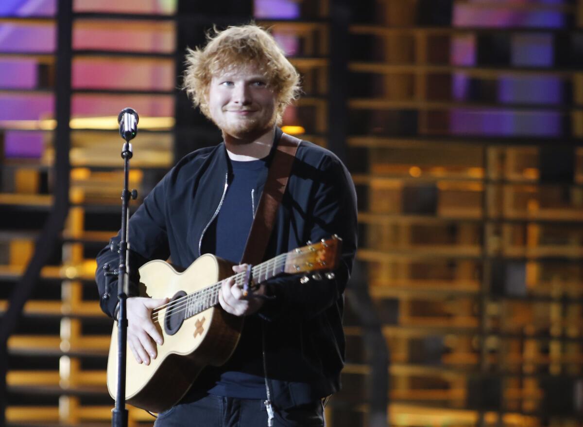 English singer-songwriter Ed Sheeran is named in a $20-million copyright infringement lawsuit filed Wednesday, June 8, in Los Angeles. It alleges that his hit "Photograph" borrowed key elements of its chorus from an earlier song, "Amazing."