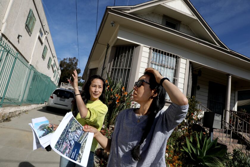 LOS ANGELES, CA - MARCH 17: Phyllis Ling, left, and sister Tany Ling, who live along the 400 block of Savoy St., along with other residents are opposed to the proposed Doger Stadium gondola that will run past their homes along Bishops Rd. in the Solono Canyon neighborhood on Thursday, March 17, 2022 in Los Angeles, CA. The proposed Union Station to Dodger Stadium aerial gondola for Dodgers fans ignites controversy and opposition in Solono Canyon neighborhood. (Gary Coronado / Los Angeles Times)