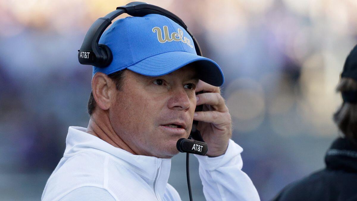 UCLA football coach Jim Mora looks toward the field during an Oct. 28 game against Washington.