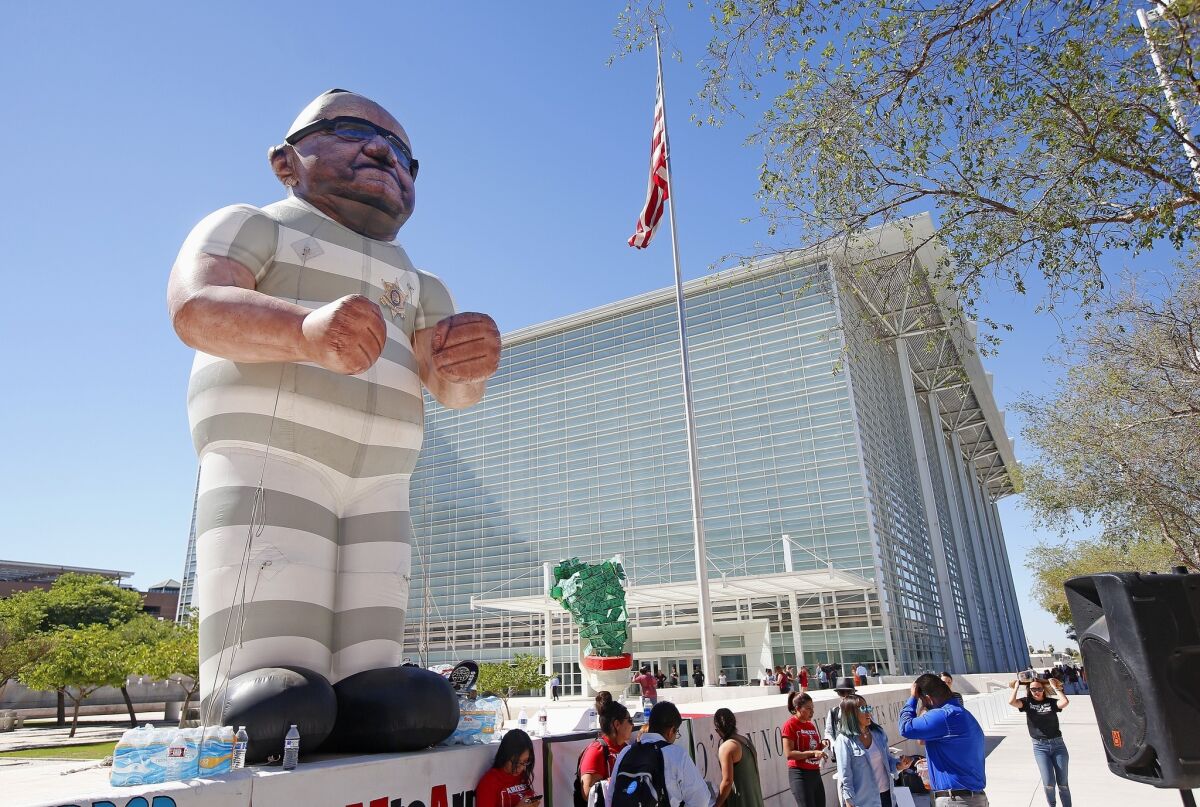 Protesters in Phoenix with an effigy of Maricopa Country Sheriff Joe Arpaio wearing prison clothes.