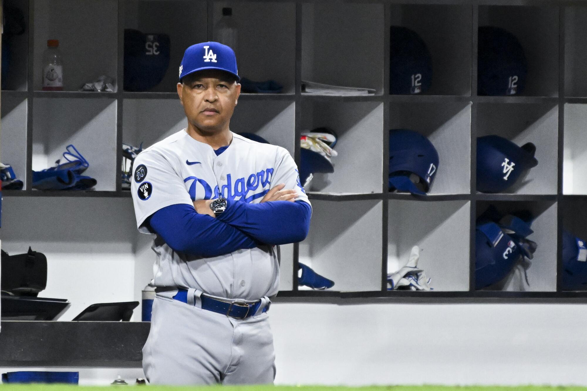 Dodgers manager Dave Roberts watches from the dugout during Game 3 of the NLDS against the San Diego Padres in October.