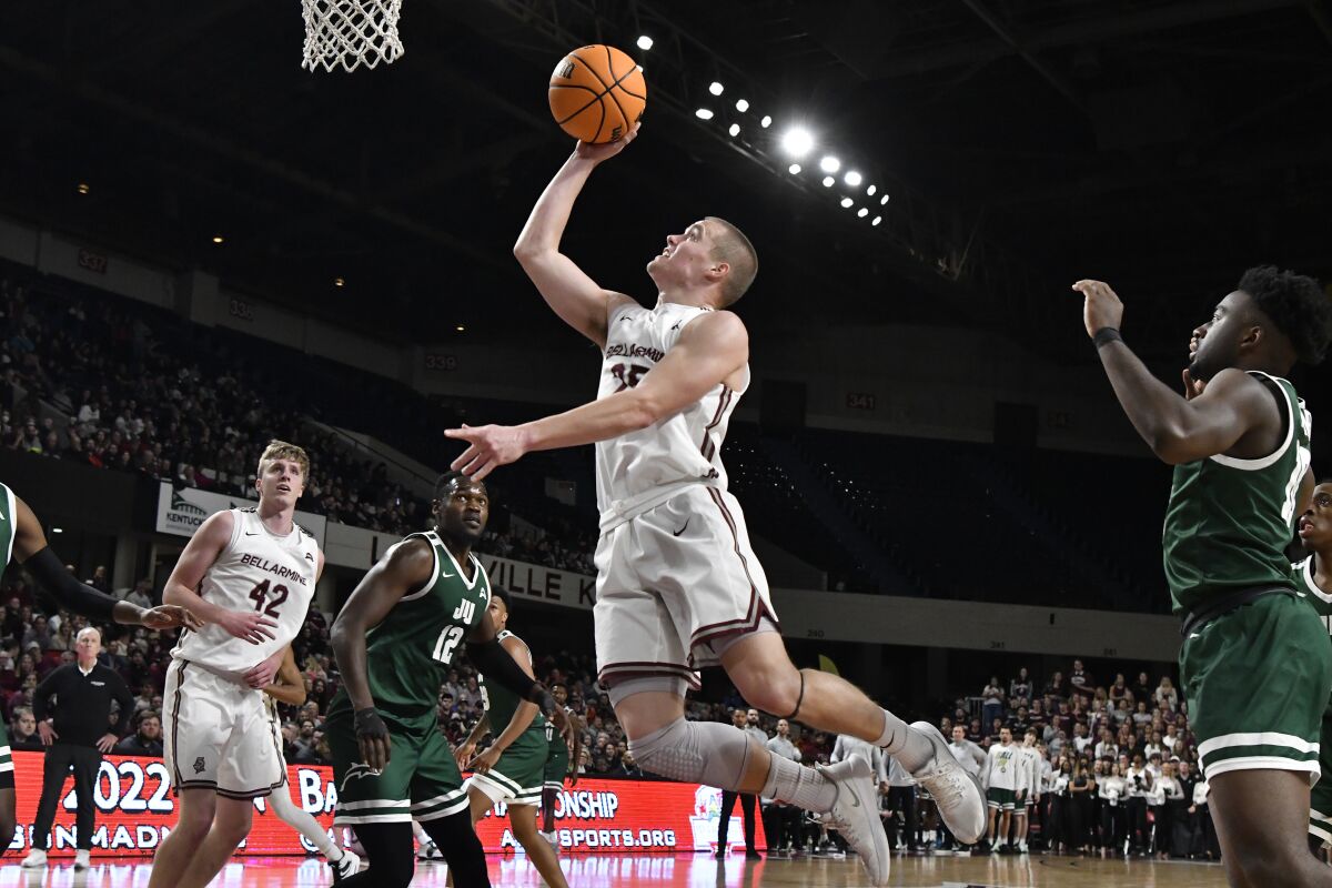 Bellarmine guard CJ Fleming (25) goes up for a layup during the second half of an NCAA college basketball against Jacksonville for the championship of the Atlantic Sun Conference men's tournament in Louisville, Ky., Tuesday, March 8, 2022. Bellarmine won 77-72. (AP Photo/Timothy D. Easley)