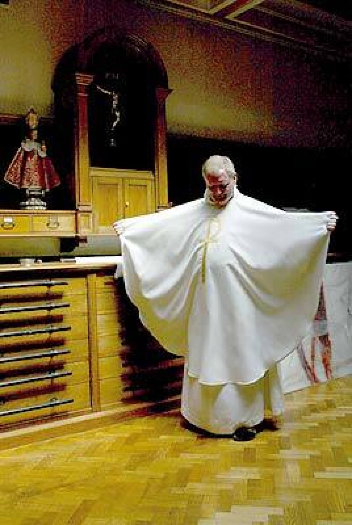 GETTING CENTERED: Father John Noonan prepares for a service at St. Teresa of Avila Church in Dublin.