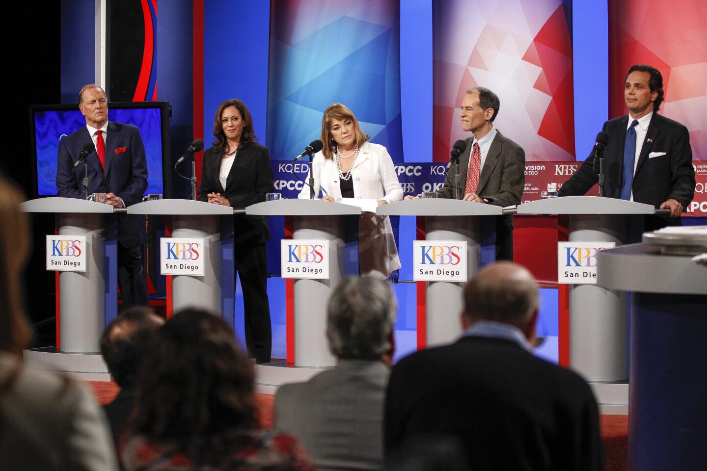 The top five candidates running to replace retiring Sen. Barbara Boxer, from left, George "Duf" Sundheim, Kamala Harris, Loretta Sanchez, Ron Unz and Tom Del Beccaro, stand on stage as they debate in San Diego on May 10.