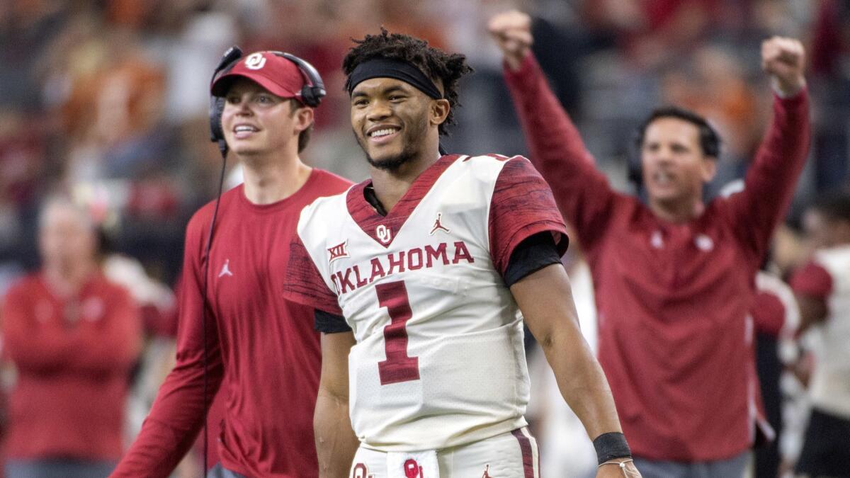 Oklahoma quarterback Kyler Murray beams from the sidelines after throwing a touchdown during the second half of the Big 12 Conference championship game in Arlington, Texas, on Dec. 1, 2018.