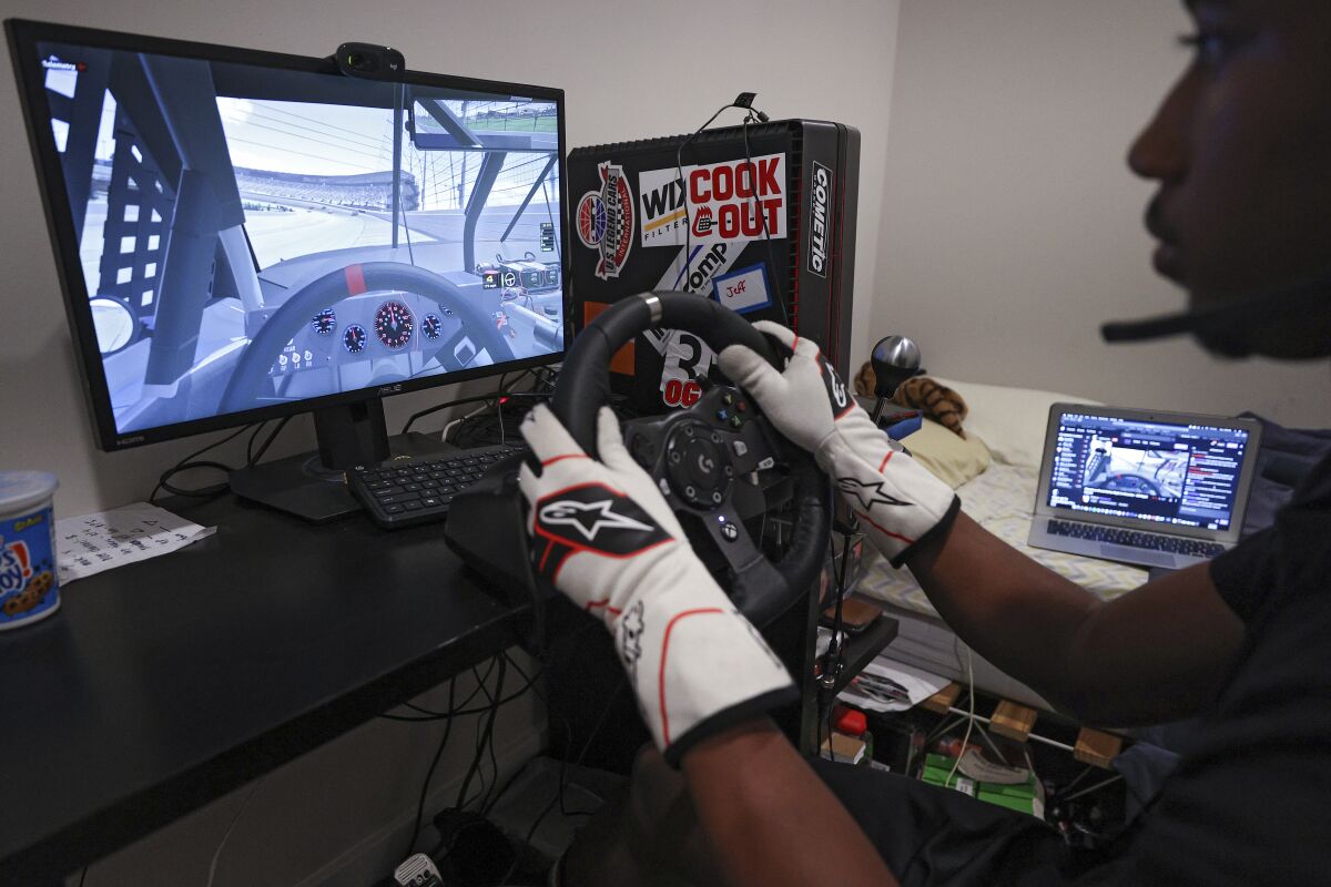 NASCAR Drive For Diversity Driver, Rajah Caruth competes in the eTruck Series Night in America.